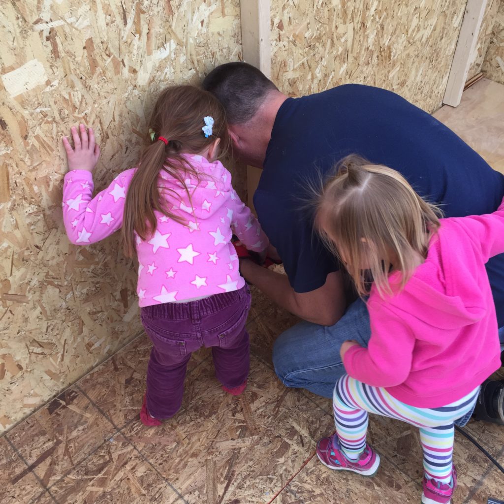 Hubby building the shed with the girls